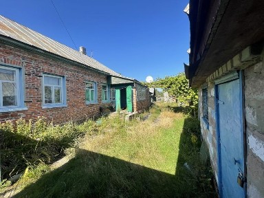 Продам добротний будинок дерев'яний обкладений кирпичем в с. Добрянка