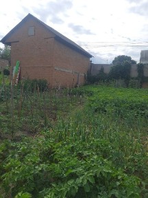 Продам частину будинку з гаражем