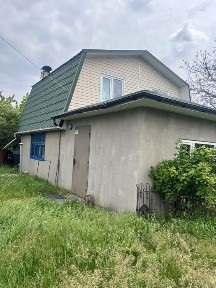 Будинок з господарськими будівлями Романки