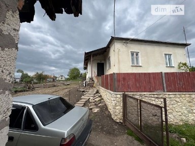 Продаж 1 поверхового будинку з опаленням і ділянкою на 25 соток, 90.4 кв. м, 3 кімнати, на вул. Миру • ID 34514402