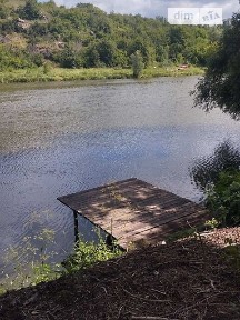 Продаж 1 поверхового будинку з гаражем і ділянкою на 14 соток, 53.9 кв. м, 2 кімнати, на вулиця Набережна • ID 34476418